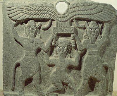 Relief depicting Gilgamesh between two bull-men supporting a winged sun disk, from Tell-Halaf, Syria by Assyrian